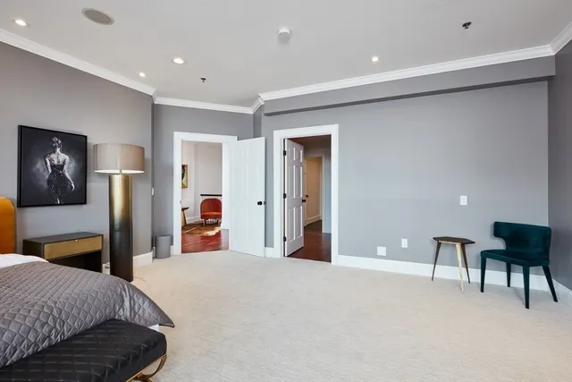 a bedroom with a bed and a desk