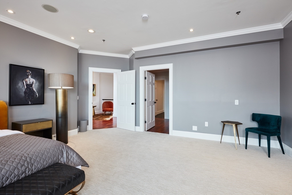 234 Causeway Street, Unit 913/813 Boston, MA 02114 - Photo 3 of 22 a bedroom with a bed and a desk