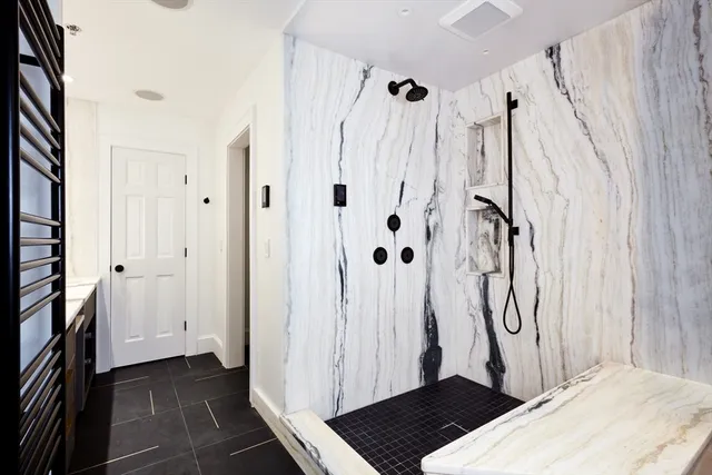 a view of a bathroom with a sink and a shower