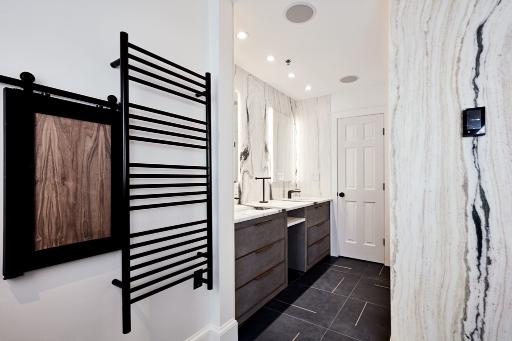 234 Causeway Street, Unit 913/813 Boston, MA 02114 - Photo 5 of 22 a bathroom with a double vanity sink and mirror