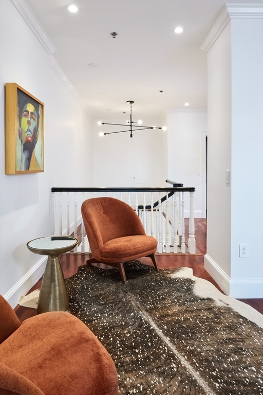 234 Causeway Street, Unit 913/813 Boston, MA 02114 - Photo 9 of 22 a living room with furniture a rug and white walls