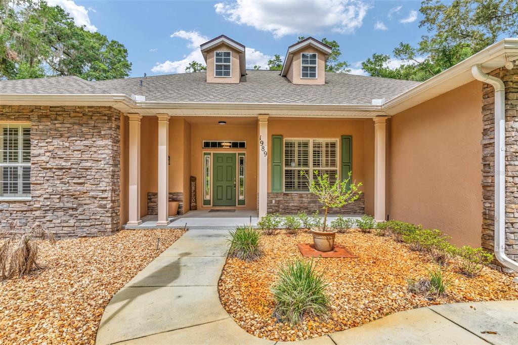 1989 Northwest 111th Loop Ocala, FL 34475 - Photo 6 of 55 a view of a house with outdoor space
