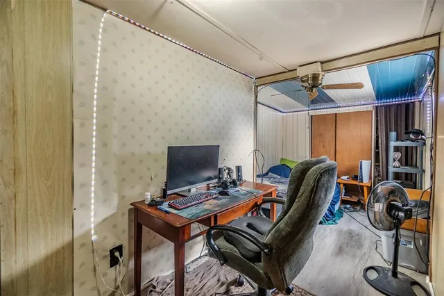 a bedroom with furniture and gym equipment