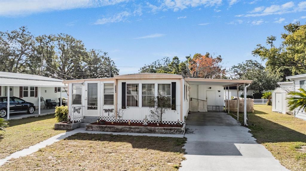 5646 Ave New Port New Port Richey, FL 34652 - Photo 21 of 29 a front view of a house with garden