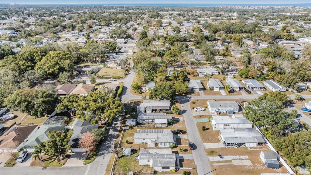 5646 Ave New Port New Port Richey, FL 34652 - Photo 25 of 29 an aerial view of residential building with green space