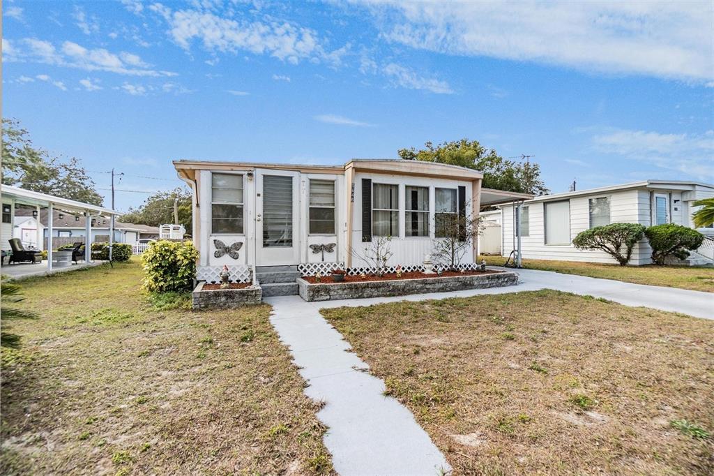 5646 Ave New Port New Port Richey, FL 34652 - Photo 29 of 29 a view of a house with swimming pool and sitting area