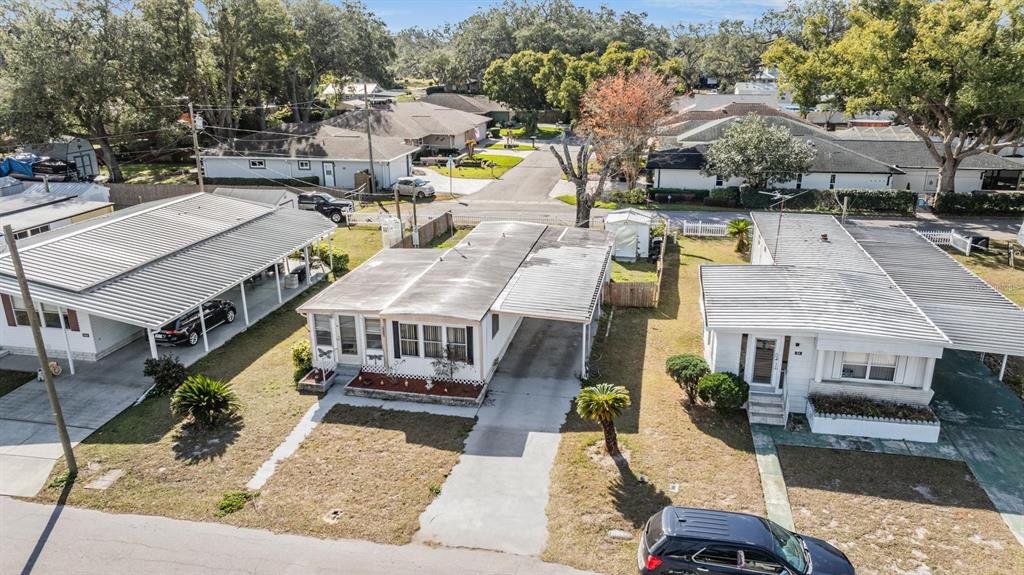 5646 Ave New Port New Port Richey, FL 34652 - Photo 5 of 29 an aerial view of a house with a yard swimming pool and large trees