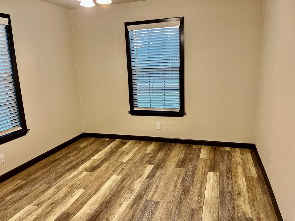2078 Lower Crabapple Road Fredericksburg, TX 78624 - Photo 2 of 44 a view of a room with wooden floor and a window