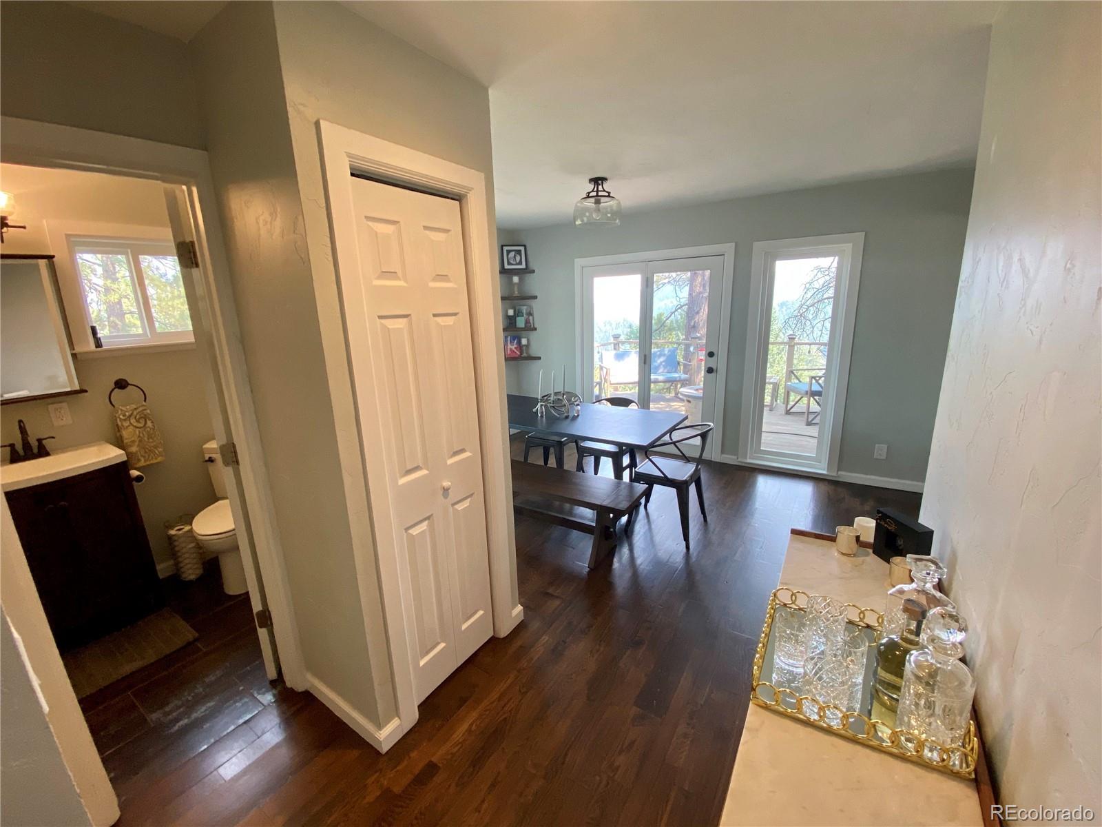 44 Pine Road Golden, CO 80401 - Photo 13 of 35 a view of a dining room with furniture window and wooden floor