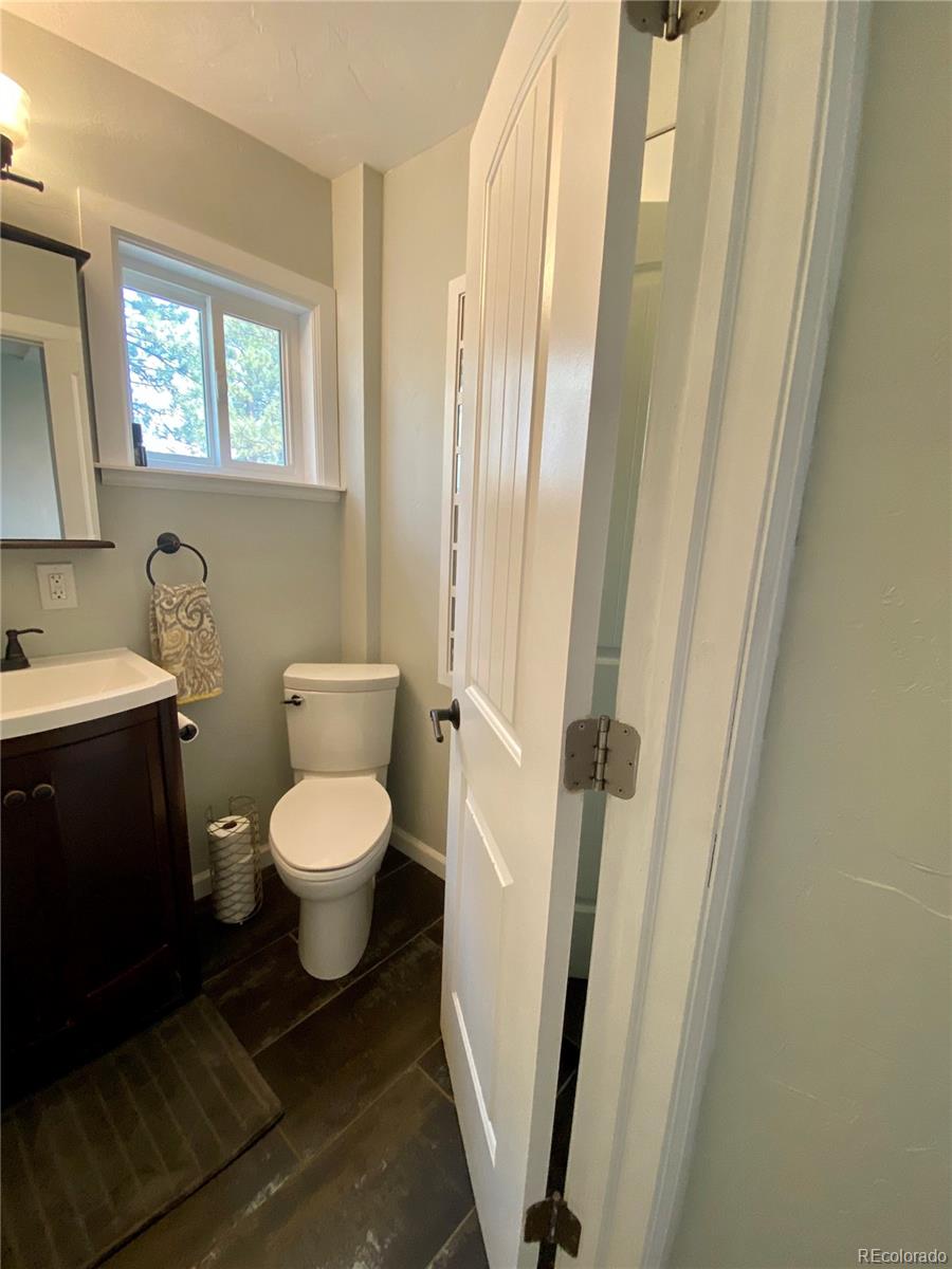 44 Pine Road Golden, CO 80401 - Photo 14 of 35 a bathroom with a toilet and a sink