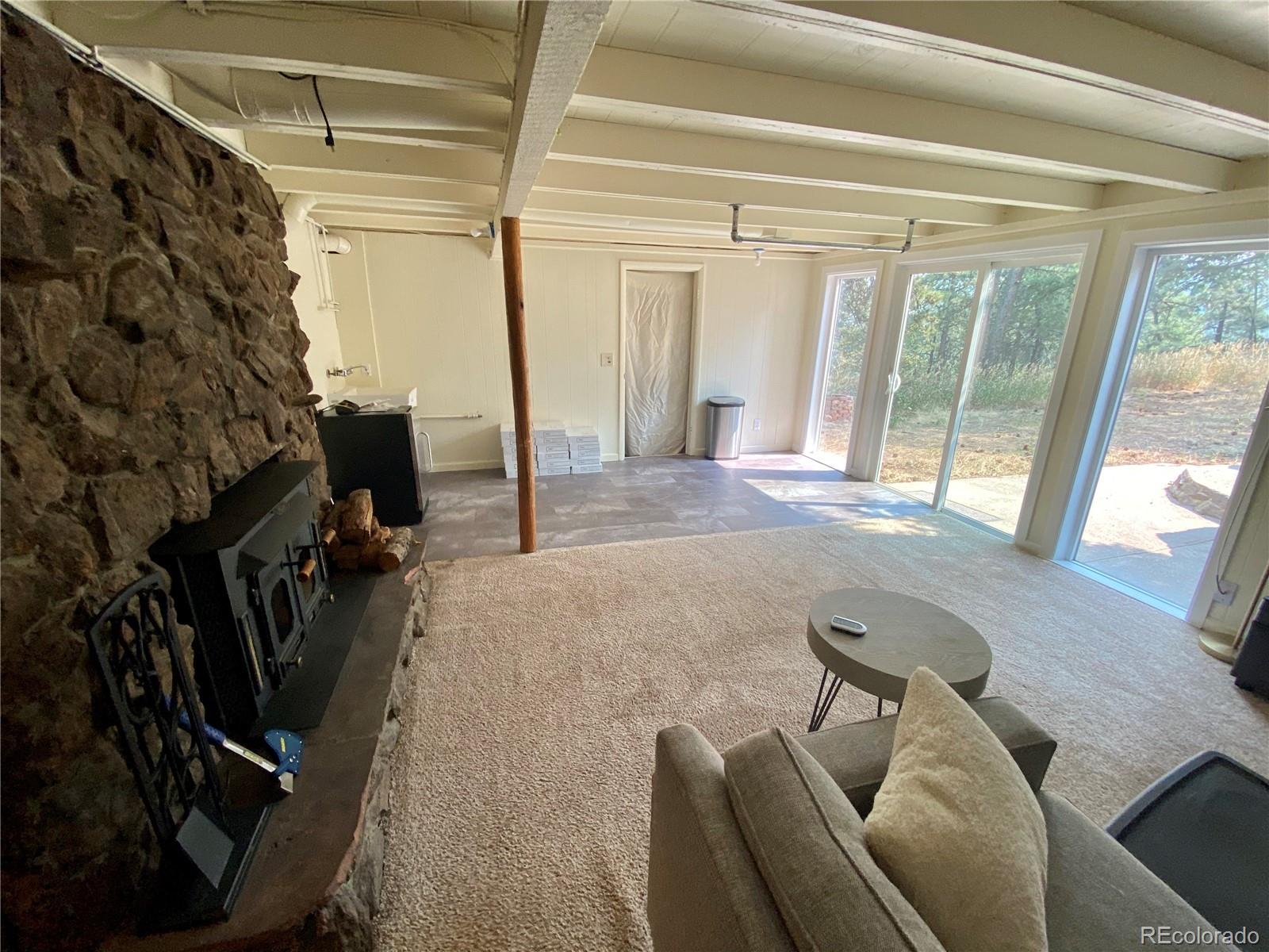 44 Pine Road Golden, CO 80401 - Photo 19 of 35 a view of a livingroom with furniture and a floor to ceiling window