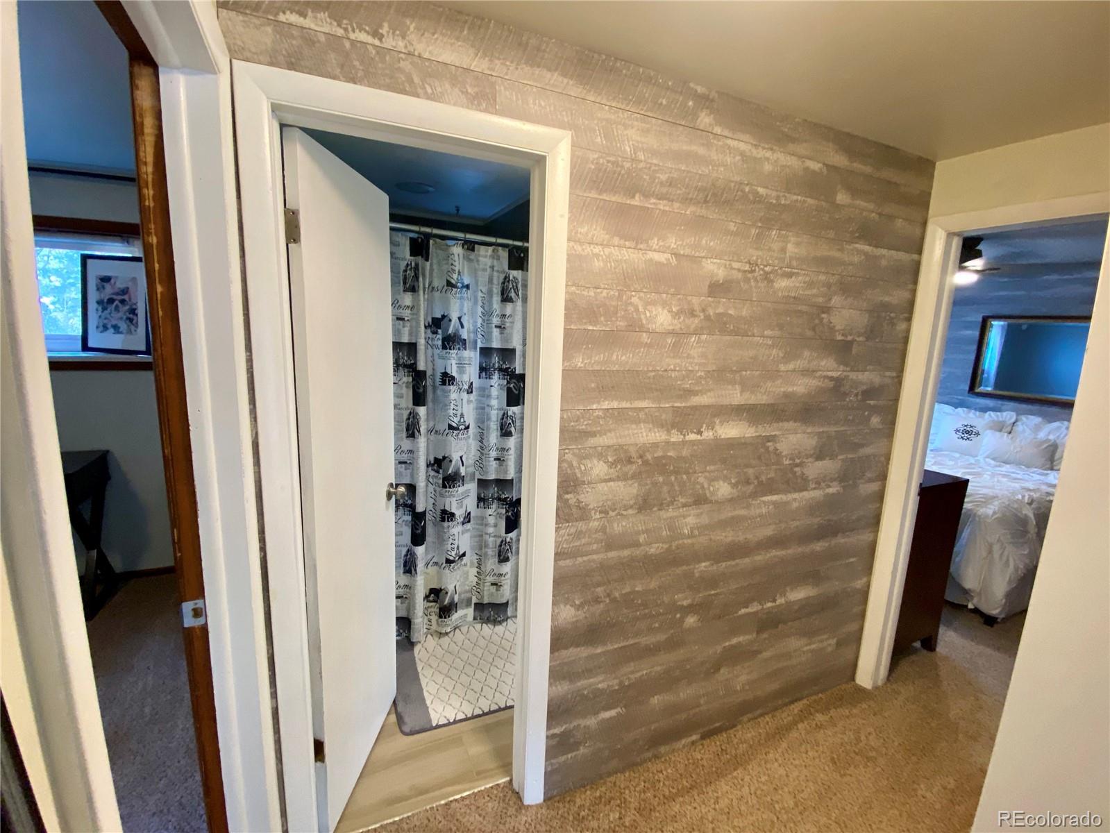 44 Pine Road Golden, CO 80401 - Photo 21 of 35 a bathroom with a shower and a mirror