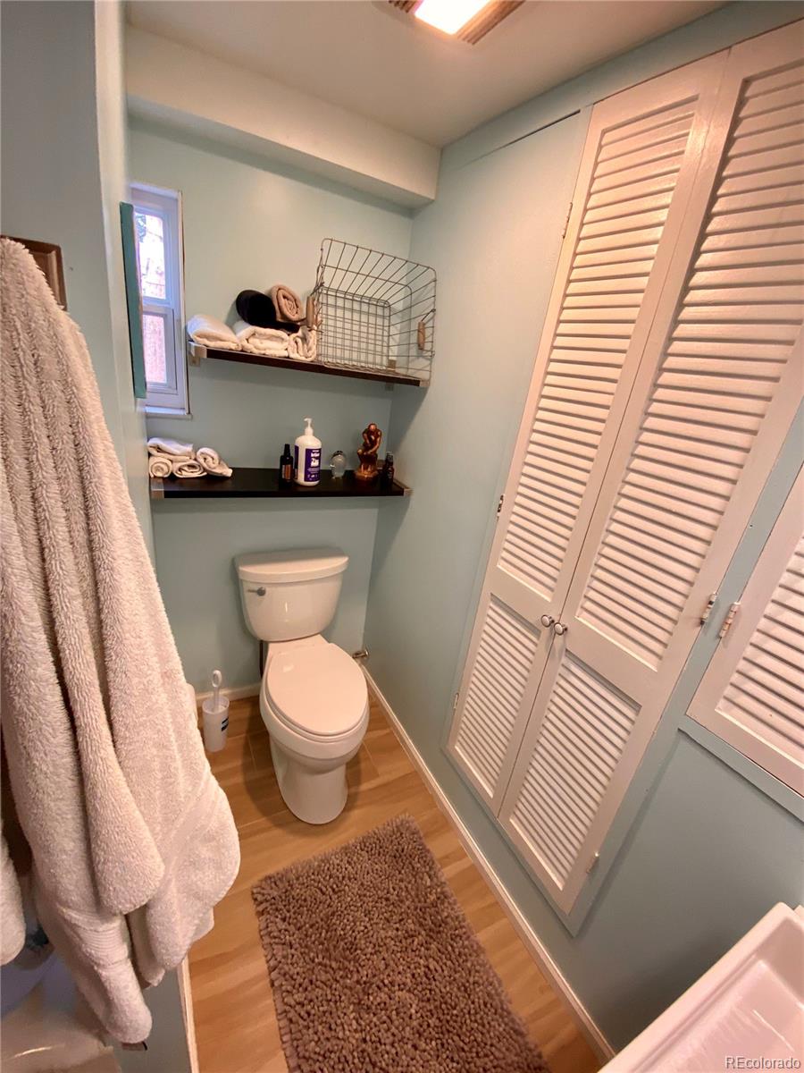 44 Pine Road Golden, CO 80401 - Photo 23 of 35 a bathroom with a toilet a sink and a window