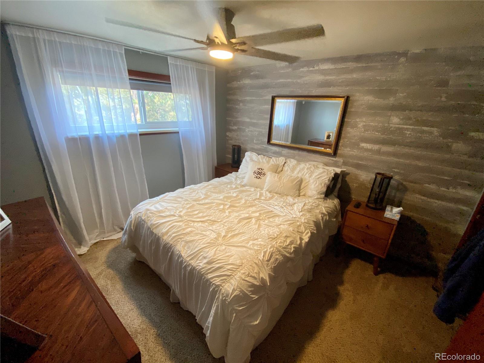 44 Pine Road Golden, CO 80401 - Photo 24 of 35 a bedroom with a bed and a mirror