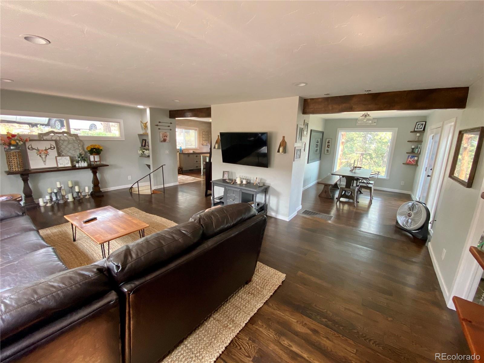 44 Pine Road Golden, CO 80401 - Photo 10 of 35 a living room with furniture and a flat screen tv