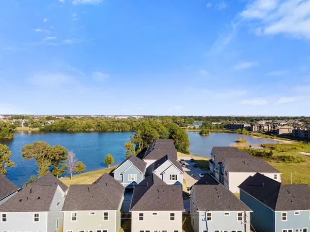 an aerial view of a ocean with city view