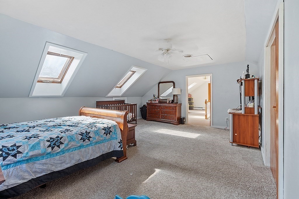 479-483 Gleasondale Road Stow, MA 01775 - Photo 13 of 40 a bedroom with bed and window