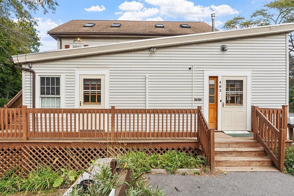 479-483 Gleasondale Road Stow, MA 01775 - Photo 14 of 40 a front view of a house with a garden