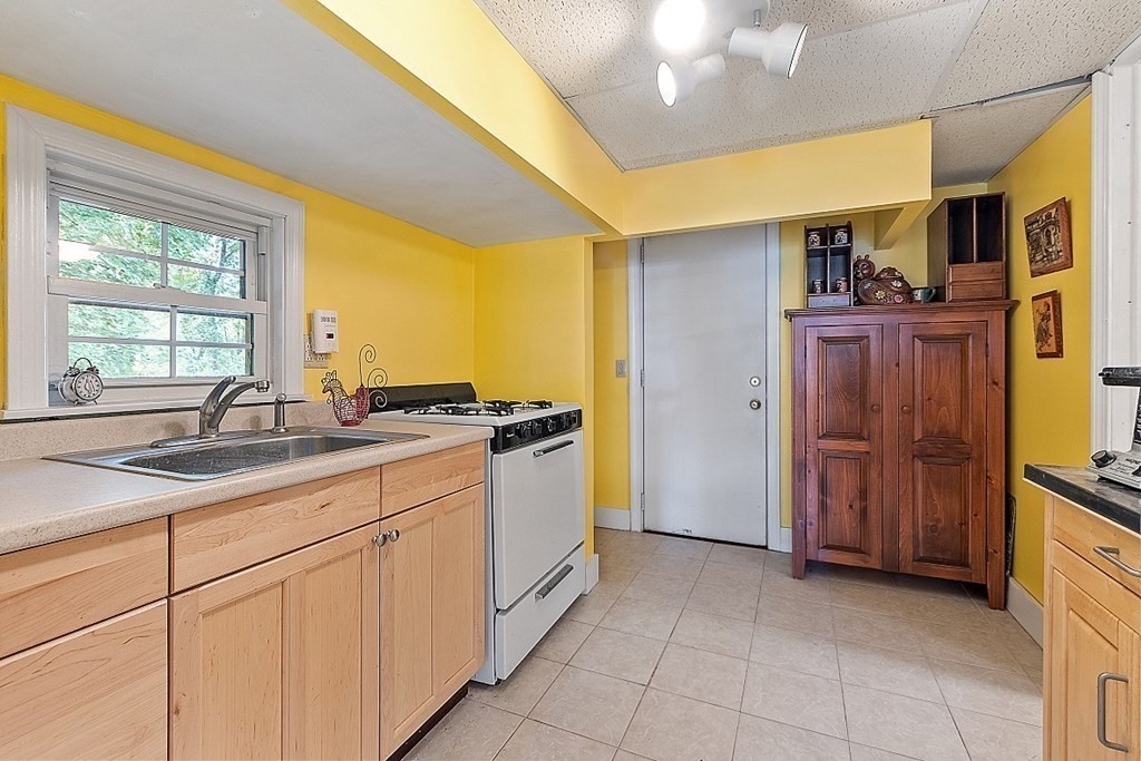 479-483 Gleasondale Road Stow, MA 01775 - Photo 18 of 40 a kitchen with a sink and cabinets