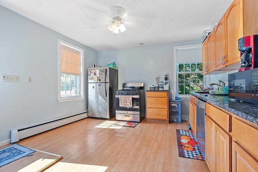 479-483 Gleasondale Road Stow, MA 01775 - Photo 2 of 40 a view of kitchen with furniture and window