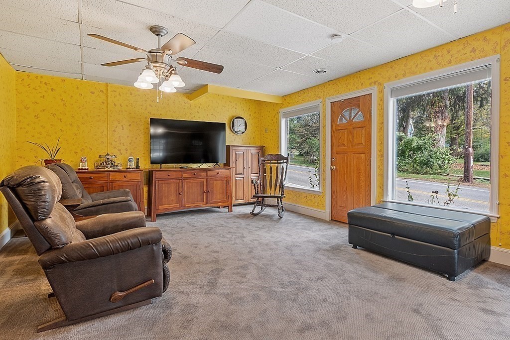 479-483 Gleasondale Road Stow, MA 01775 - Photo 25 of 40 a living room with furniture and a flat screen tv