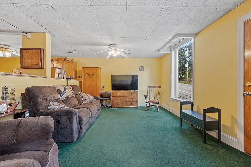 479-483 Gleasondale Road Stow, MA 01775 - Photo 26 of 40 a living room with furniture and a flat screen tv
