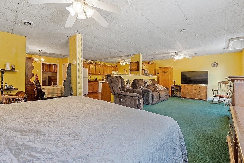 479-483 Gleasondale Road Stow, MA 01775 - Photo 27 of 40 a bed room with two bed and a flat tv screen