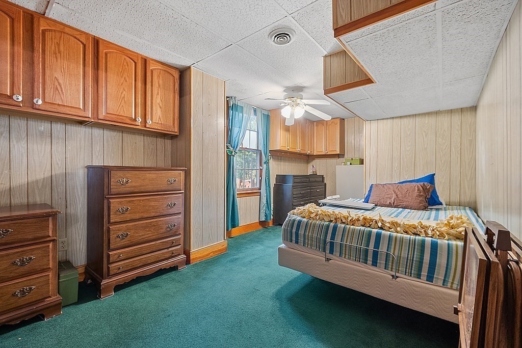 479-483 Gleasondale Road Stow, MA 01775 - Photo 29 of 40 a bedroom with a bed and a dresser