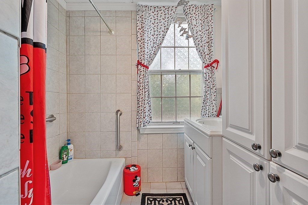 479-483 Gleasondale Road Stow, MA 01775 - Photo 30 of 40 a bathroom with a bathtub and shower