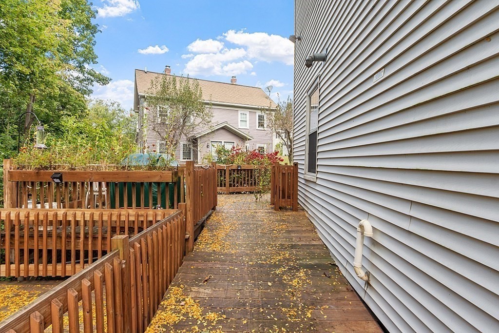 479-483 Gleasondale Road Stow, MA 01775 - Photo 34 of 40 a view of a brick house with a sign on a street