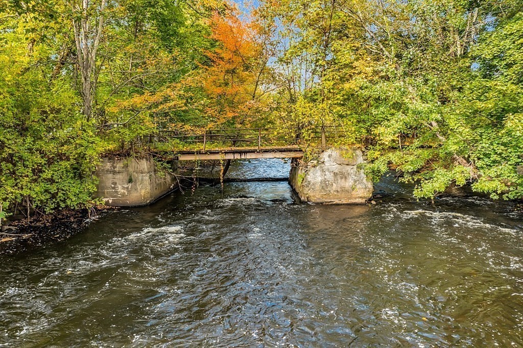 479-483 Gleasondale Road Stow, MA 01775 - Photo 35 of 40 a backyard of a house with an outdoor space