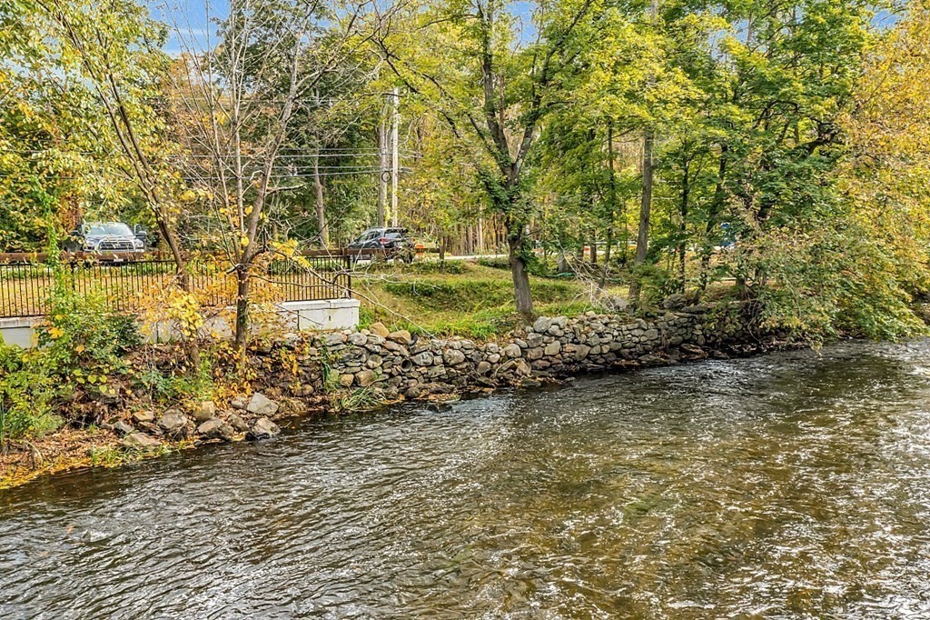 479-483 Gleasondale Road Stow, MA 01775 - Photo 36 of 40 a view of a yard with wooden fence
