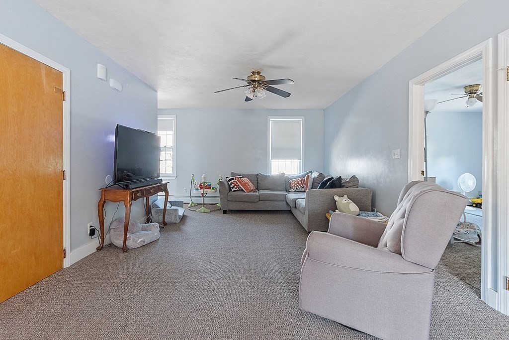 479-483 Gleasondale Road Stow, MA 01775 - Photo 5 of 40 a living room with furniture and a flat screen tv