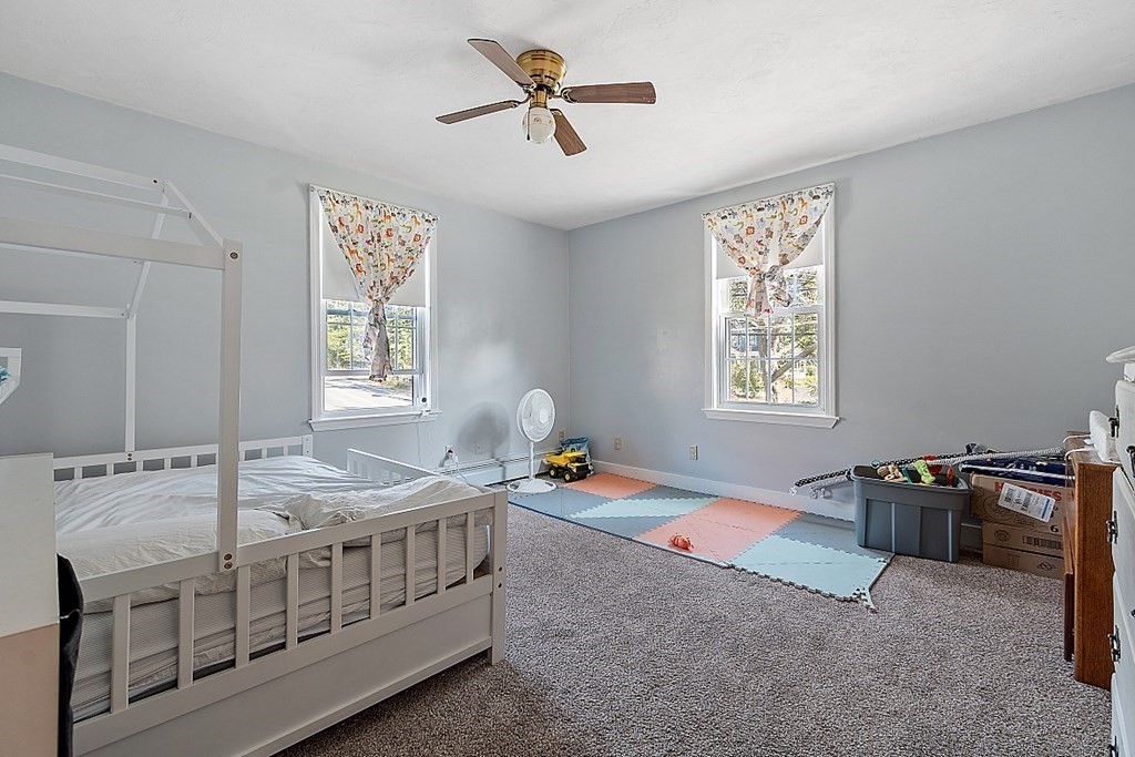 479-483 Gleasondale Road Stow, MA 01775 - Photo 6 of 40 a bedroom with furniture and windows
