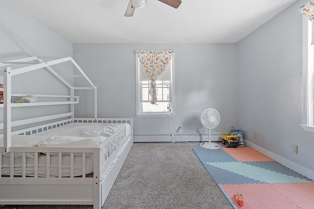 479-483 Gleasondale Road Stow, MA 01775 - Photo 7 of 40 a bedroom with a bed and window