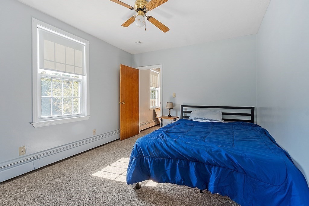 479-483 Gleasondale Road Stow, MA 01775 - Photo 8 of 40 a bedroom with a bed and a window