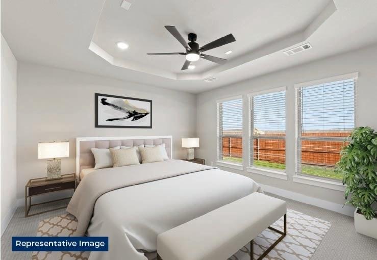 636 Cirrus Lane Fate, TX 75087 - Photo 3 of 7 a bedroom with a bed and a large window