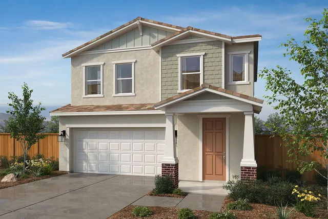a front view of a house with garage