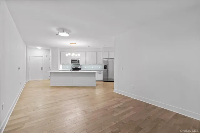 a view of kitchen with wooden floor