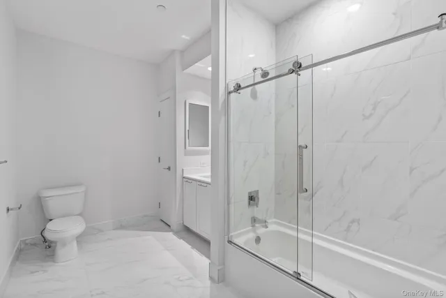 a bathroom with a shower and a toilet