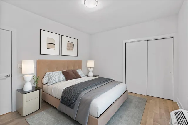 a bedroom with a bed and a lamp