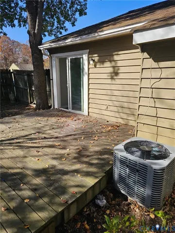 a view of house with backyard space and tree