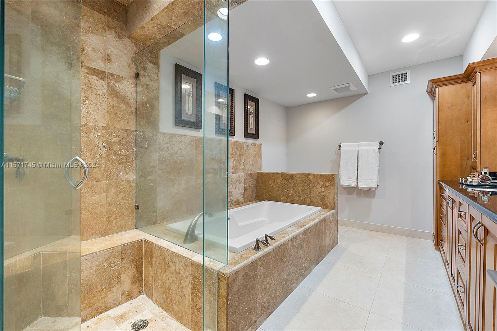 1200 Cocoanut Road Boca Raton, FL 33432 - Photo 13 of 25 a bathroom with a tub and shower
