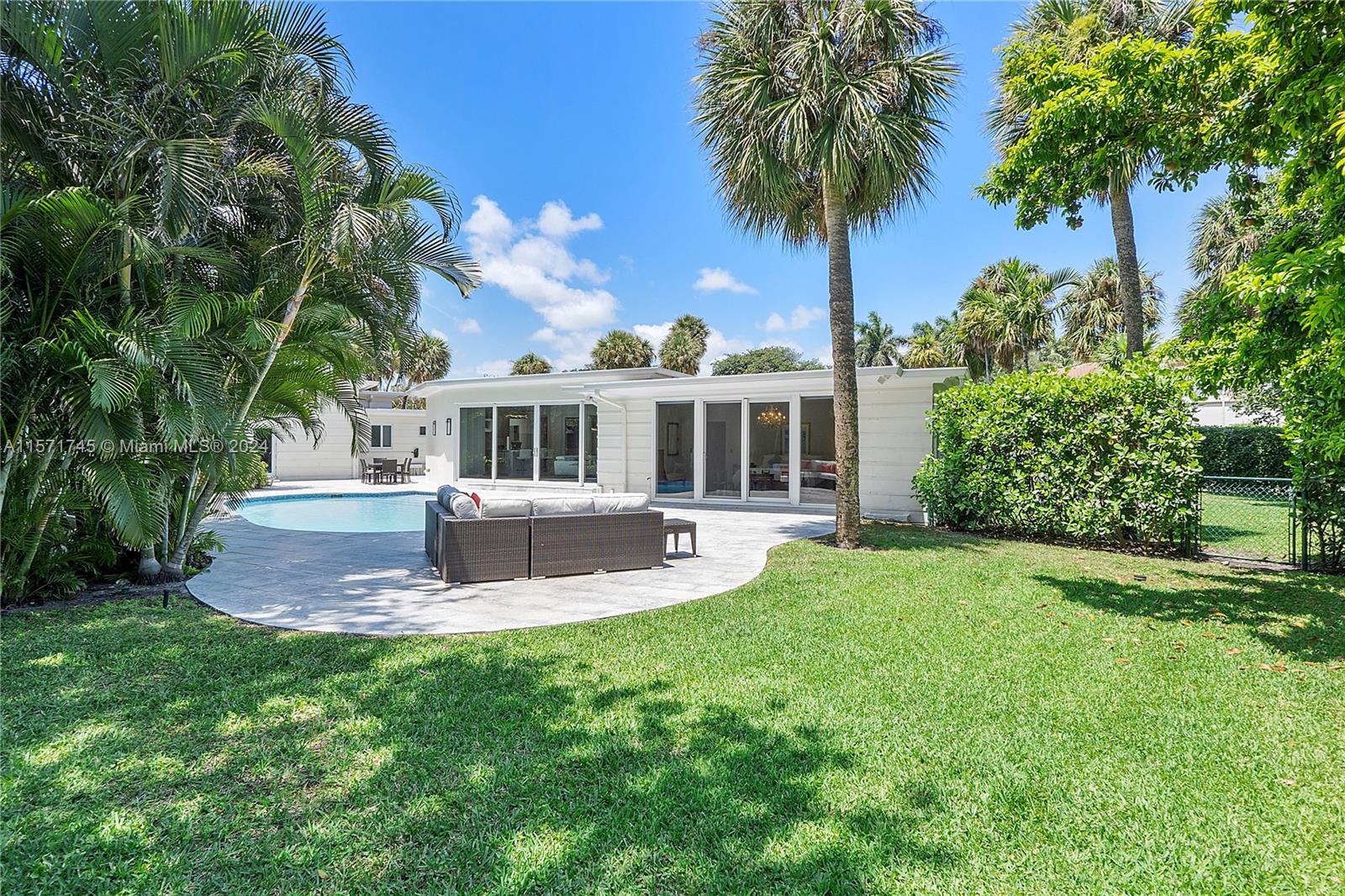 1200 Cocoanut Road Boca Raton, FL 33432 - Photo 18 of 25 a front view of a house with a yard table and chairs