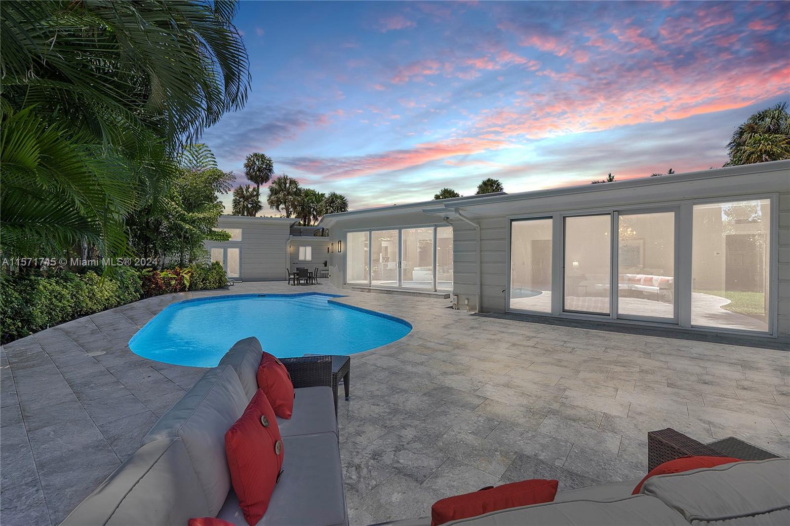 1200 Cocoanut Road Boca Raton, FL 33432 - Photo 4 of 25 a view of a swimming pool with an outdoor seating