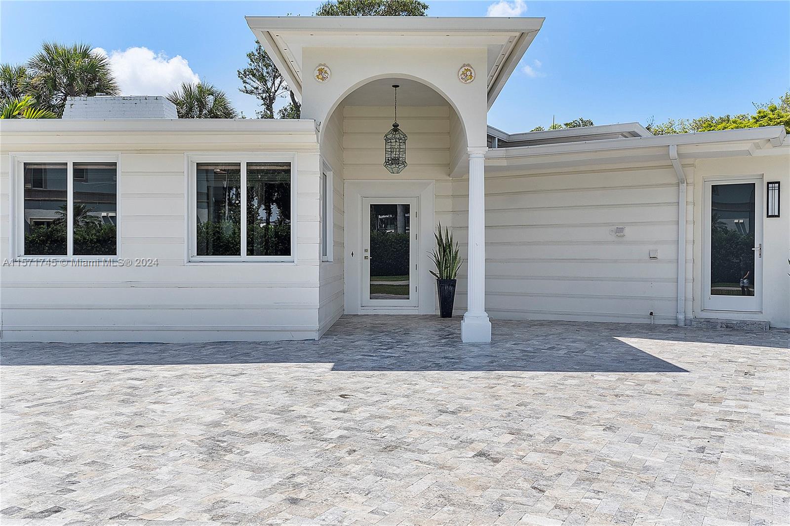 1200 Cocoanut Road Boca Raton, FL 33432 - Photo 7 of 25 a view of a entryway door front of a house