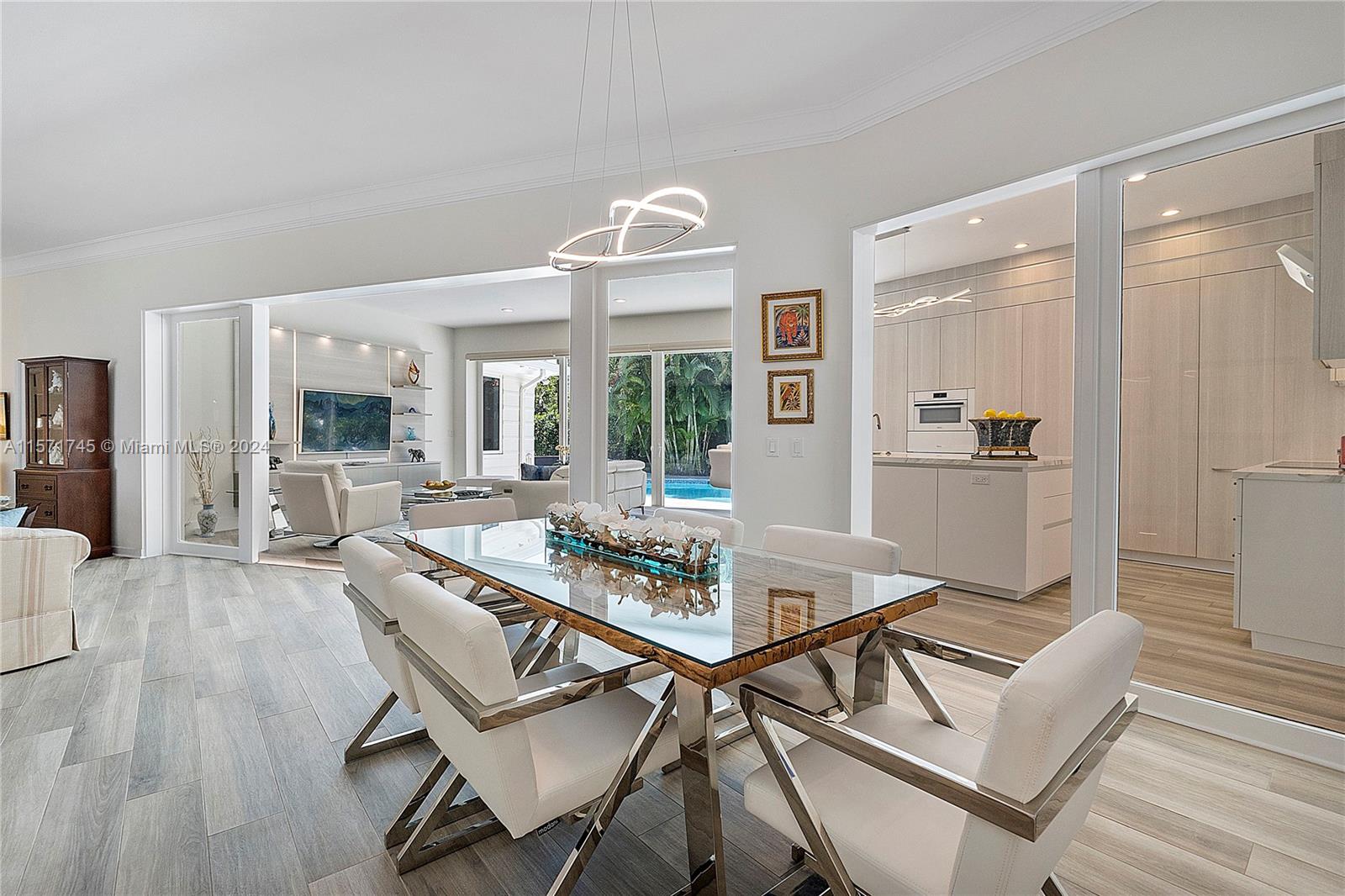 1200 Cocoanut Road Boca Raton, FL 33432 - Photo 8 of 25 a view of a dining room with furniture window and wooden floor