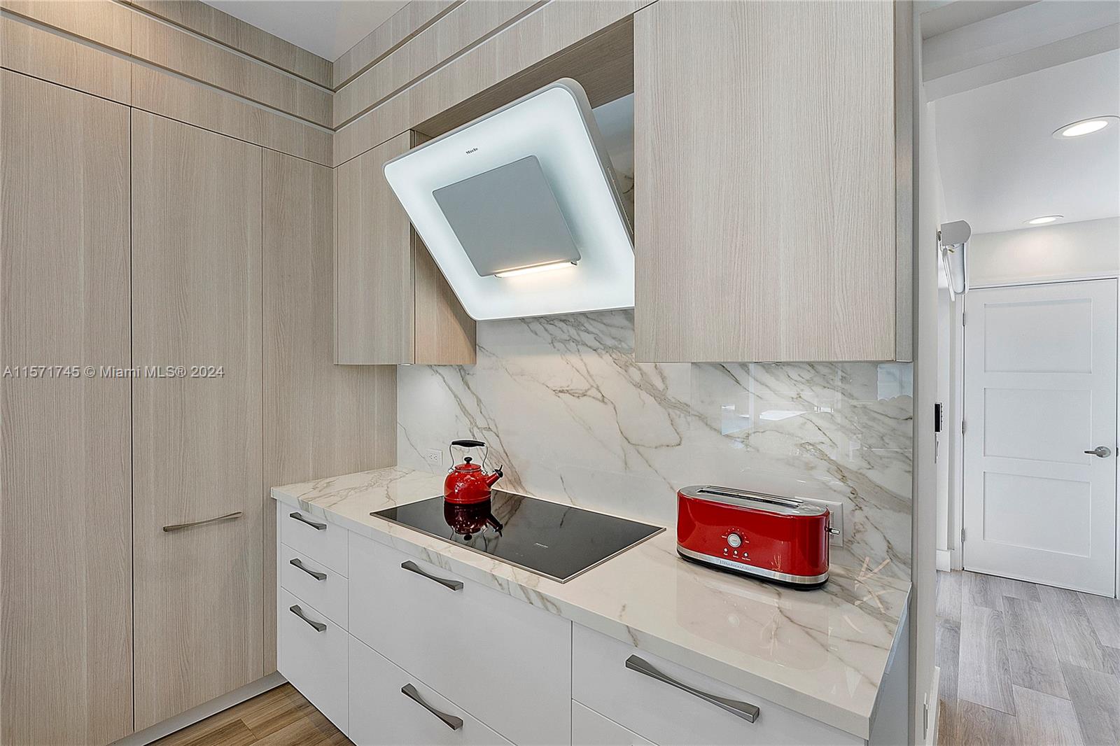 1200 Cocoanut Road Boca Raton, FL 33432 - Photo 10 of 25 a kitchen with a sink and cabinets