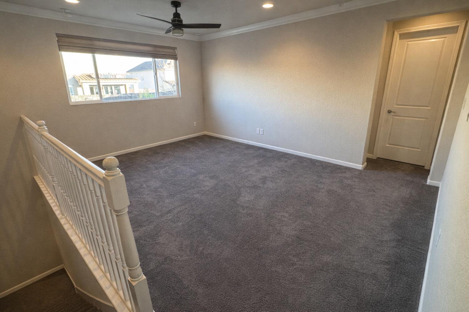 2557 Creek Hollow Road Rocklin, CA 95765 - Photo 20 of 27 a view of hallway with window and stairs