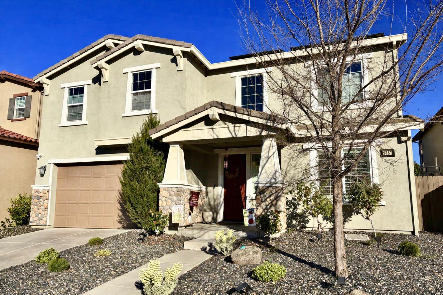 2557 Creek Hollow Road Rocklin, CA 95765 - Photo 3 of 27 a view of a house with a yard